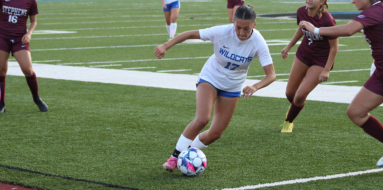 Halle Jennex dribbles around a a pair of Stephens defenders in Wednesday's 5-0 victory at Ellison Poulton Stadium. --- Photo by Hannah Mueller